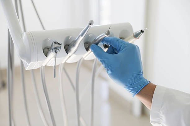 Professional Tooth Extraction technician working in Colfax, IL